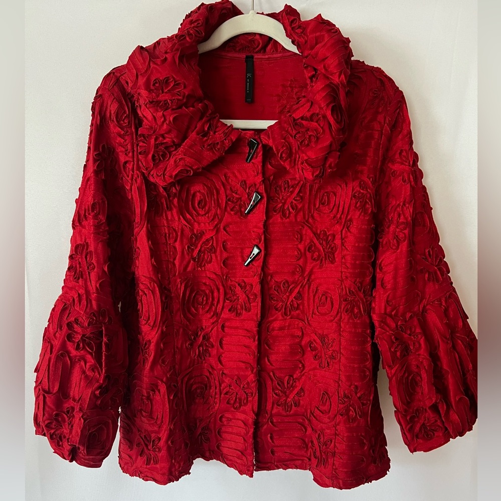 Red ruffle posh jacket by Connie K retails $179 women’s size medium. Gorgeous!
